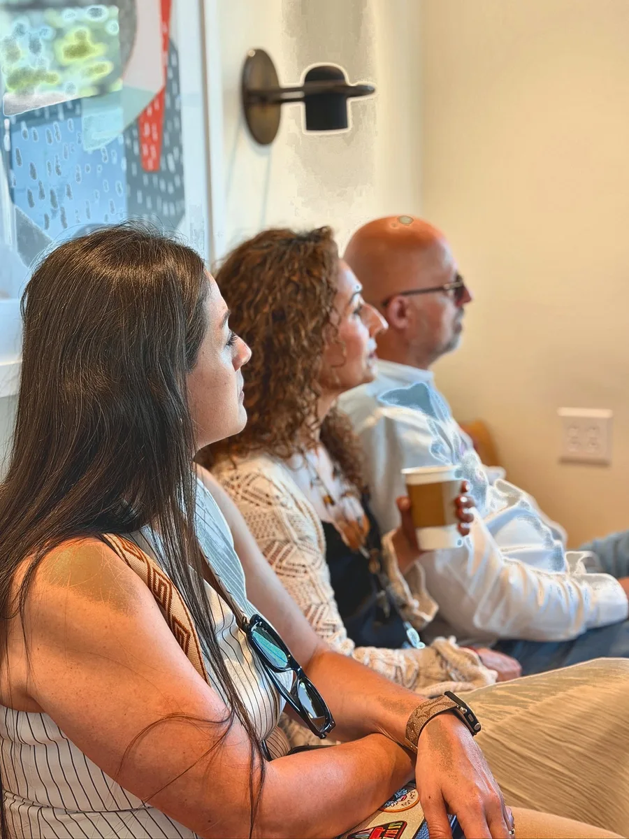 Community members in conversation at Cafecito Tech